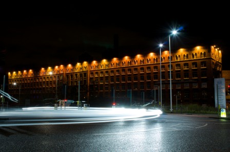 A much wider view of Meadow Mill, with passing cars creating light trails.